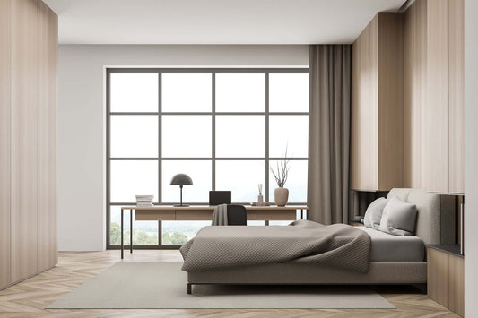 Quiet and serene bedroom designed with soundproofing features, showcasing a large window and minimalist workspace